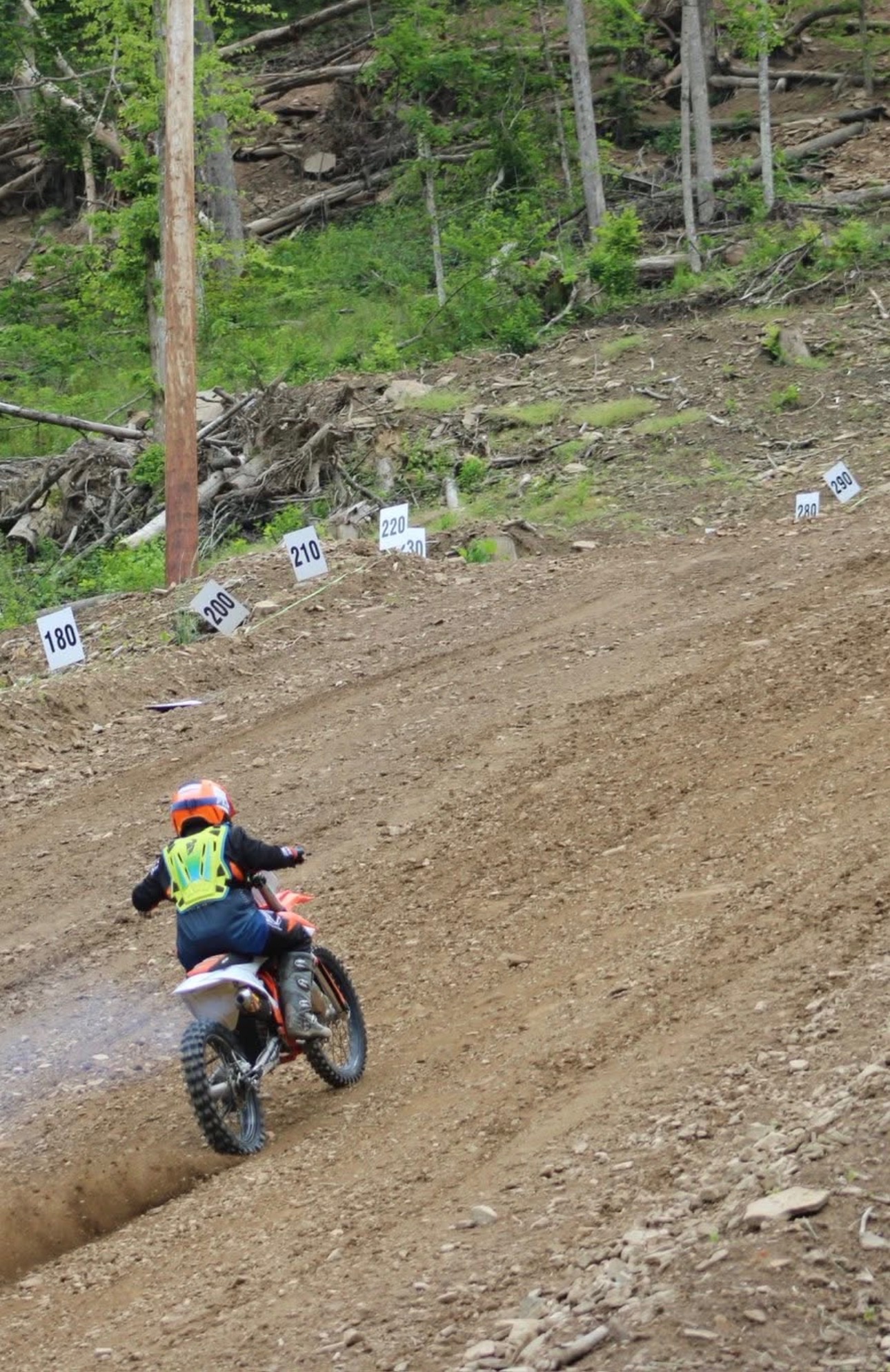 Dirt bike rider on steep hill