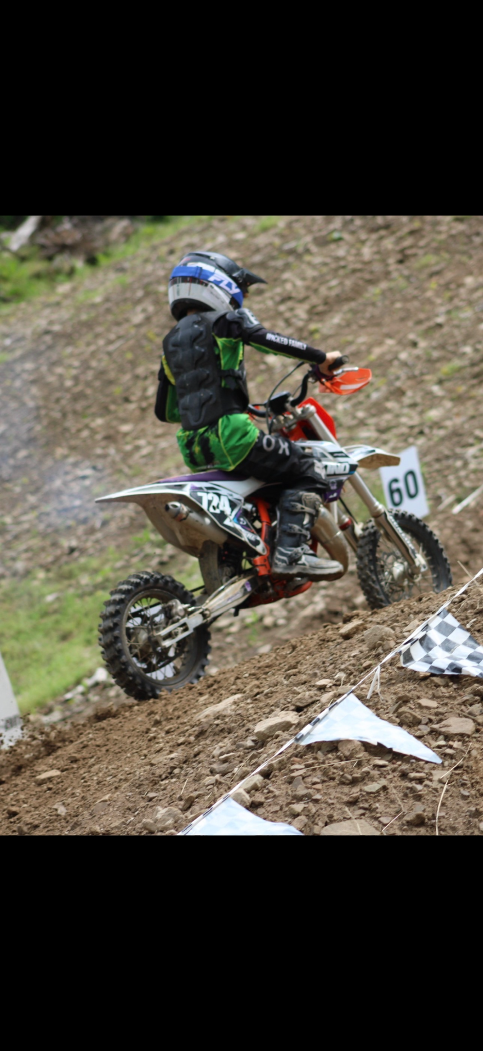 Youth dirt bike rider climbing the Moonshine hill